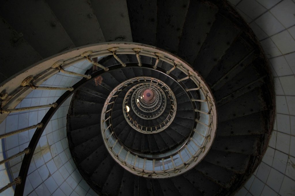 A modern spiral staircase with a striking circular pattern in La Tremblade, France.